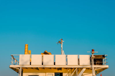 Low angle view of building against clear blue sky