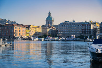 View of buildings in city against clear sky