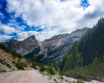 Scenic view of mountains against cloudy sky