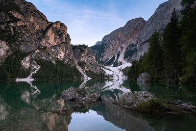Scenic view of lake and mountains against sky