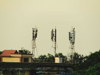 Houses and buildings against clear sky