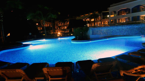 View of swimming pool at night