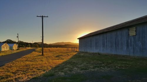 Street light by mountains against clear sky