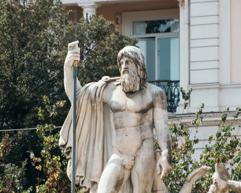 Low angle view of statue against building