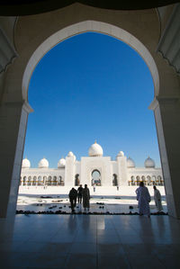 The gate of the sheikh zayed grand mosque abu dhabi with blue sky