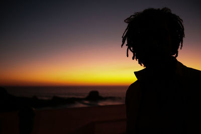 Silhouette of a man at sunset