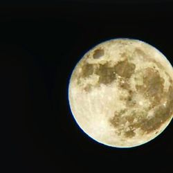 Close-up of moon over black background