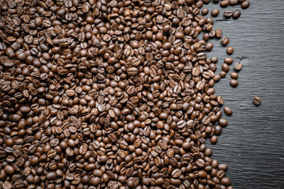 High angle view of roasted coffee beans on table