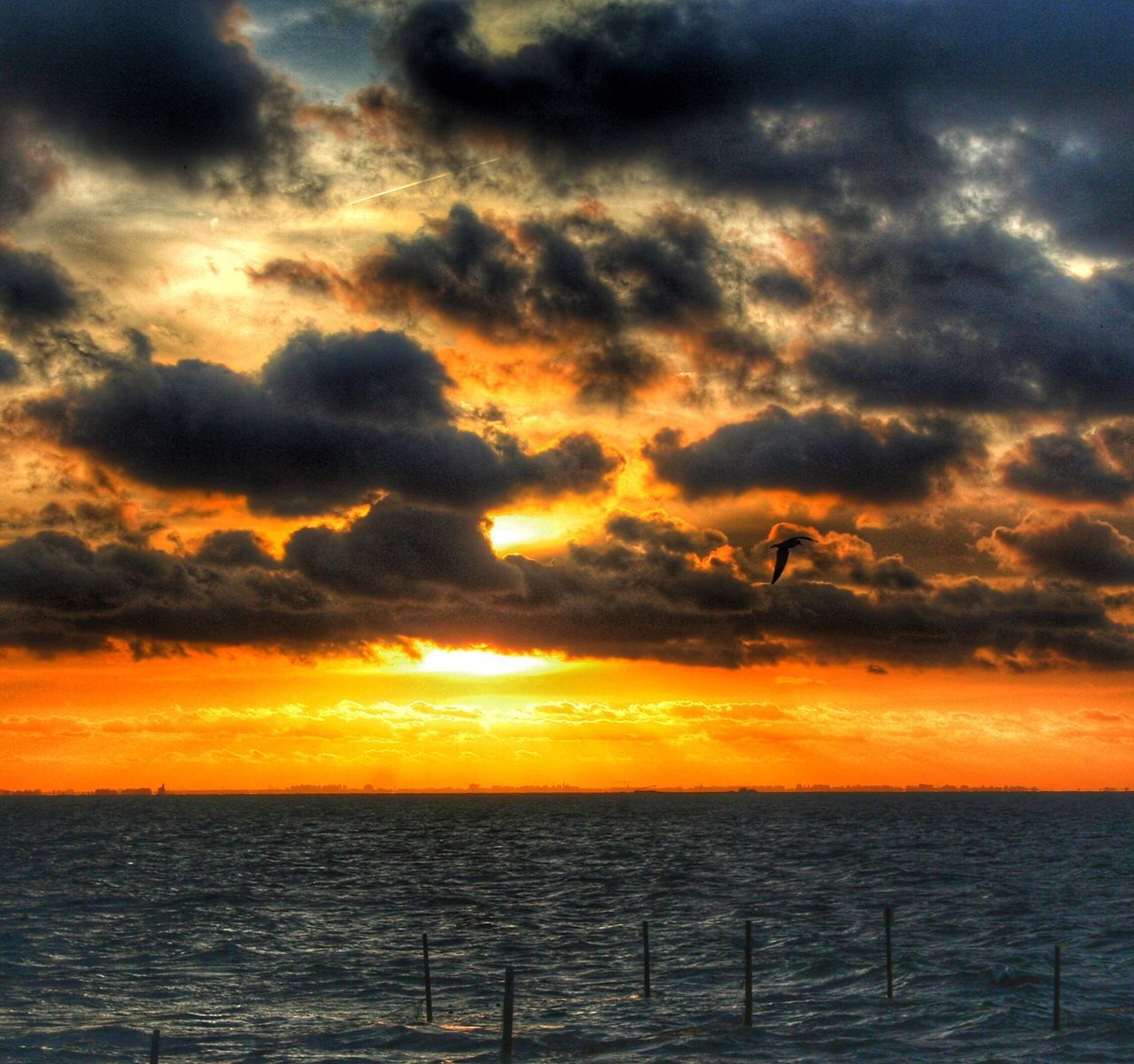 sunset, sea, nature, beauty in nature, sky, water, silhouette, scenics, horizon over water, sunbeam, cloud - sky, outdoors, tranquility, no people, sun, beach, day