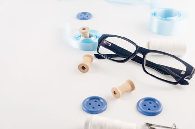 High angle view of objects on table against white background