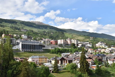 Buildings in town against sky