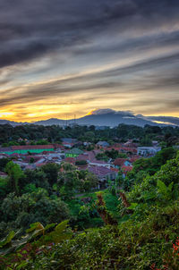 High angle view of buildings against sky during sunset