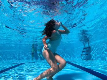 Woman swimming in pool