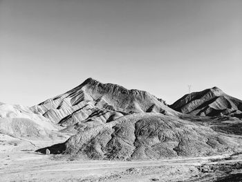 Scenic view of arid landscape against clear sky