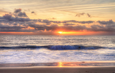 Scenic view of sea against sky during sunset