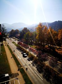 High angle view of cars on street against sky