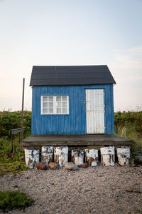 House on field against sky