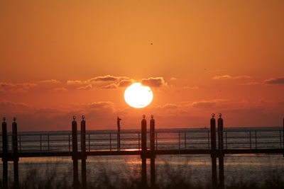 Sunset with dock near fort desota, florida