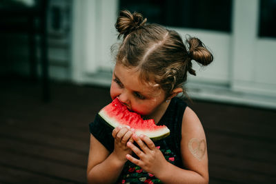 Close-up of girl eating watermelon