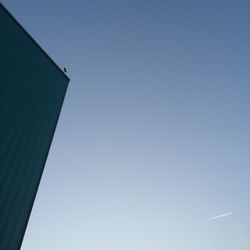 Low angle view of built structure against clear blue sky