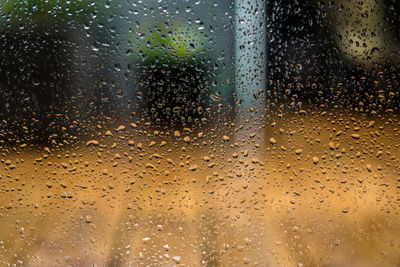 Full frame shot of wet glass window