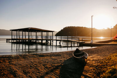 Lake docks against clear sky during sunset