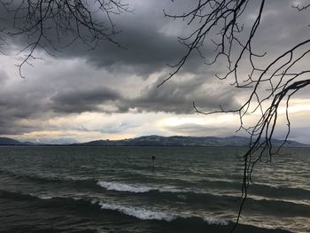 Scenic view of sea against cloudy sky