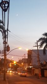 Cars on road at sunset