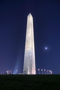 Low angle view of tower at night