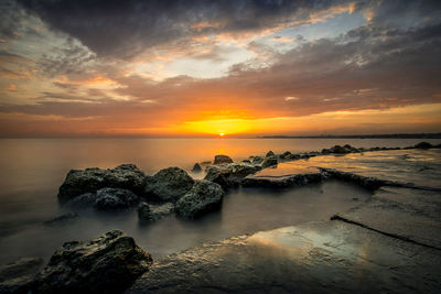 Scenic view of sea against sky during sunset