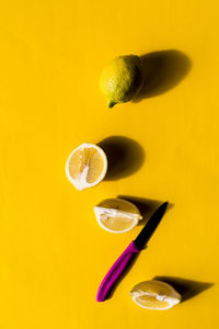 Close-up of yellow object over white background