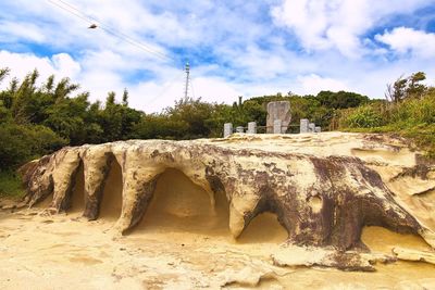 View of old ruins against cloudy sky