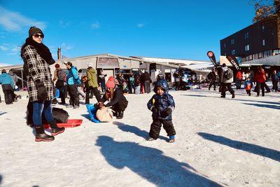 People on street against sky