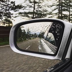 Reflection of car on side-view mirror