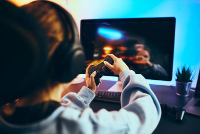 Girl playing video game. gamer playing championship tournament. competition and fun. gaming room