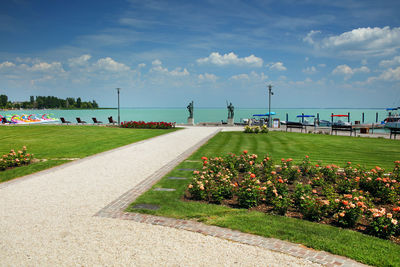 Road by sea against sky