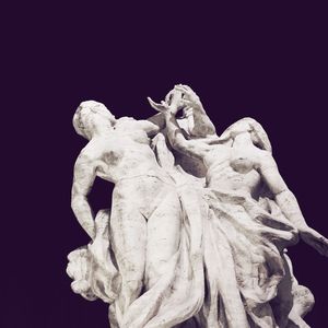 Low angle view of statue against black background