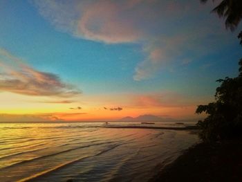 Scenic view of sea against sky at sunset