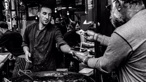 Close-up of young woman sitting on bench