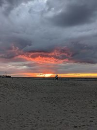 Scenic view of beach against sky during sunset