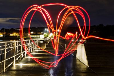 Light trails against sky at night