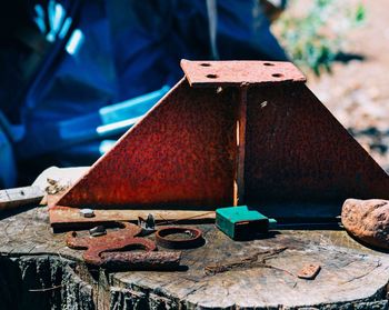 Rusty metal on log