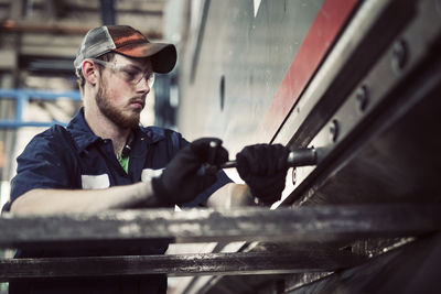 Low angle view of man working in steel industry