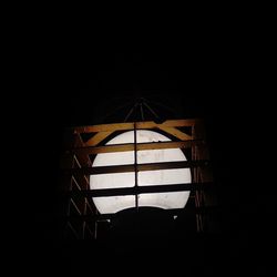 View of illuminated window in dark room