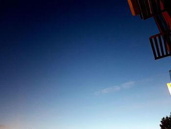 Low angle view of building against clear blue sky