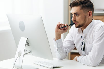 Businesswoman working at desk in office