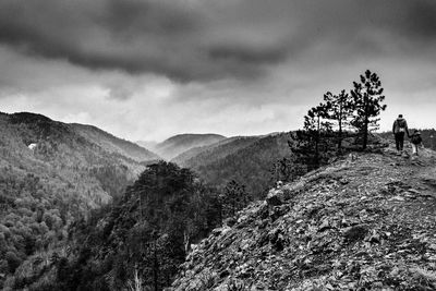 Scenic view of landscape against cloudy sky