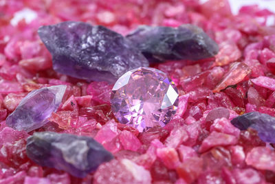 Full frame shot of pink petals on pebbles