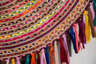 Close-up of multi colored flags hanging at market