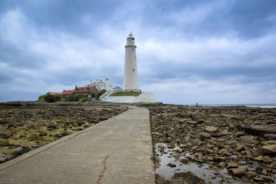 View of lighthouse against cloudy sky